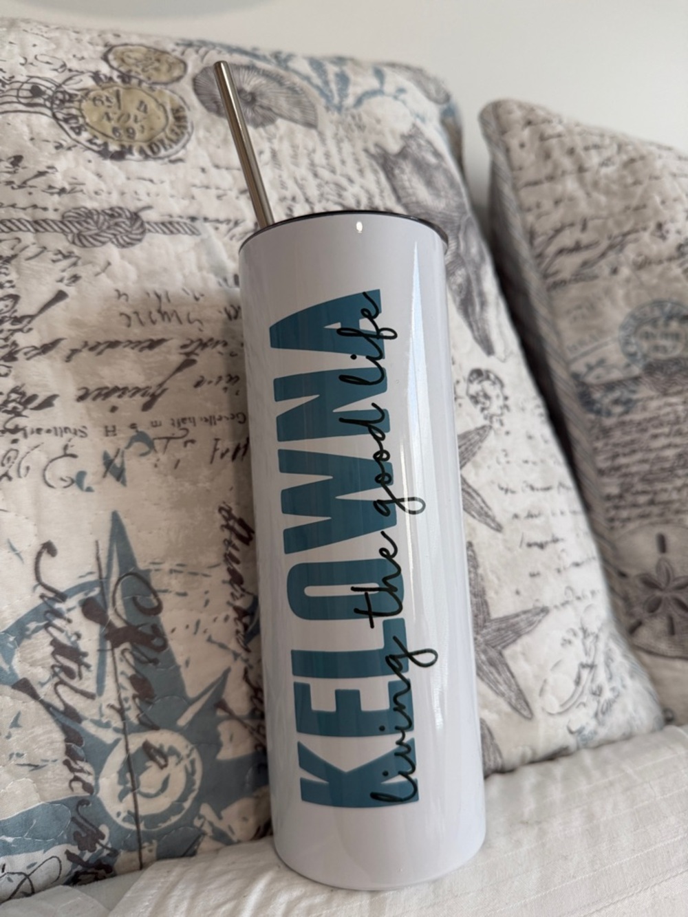 White Tumbler with Teal Blue Logo and Stainless Straw